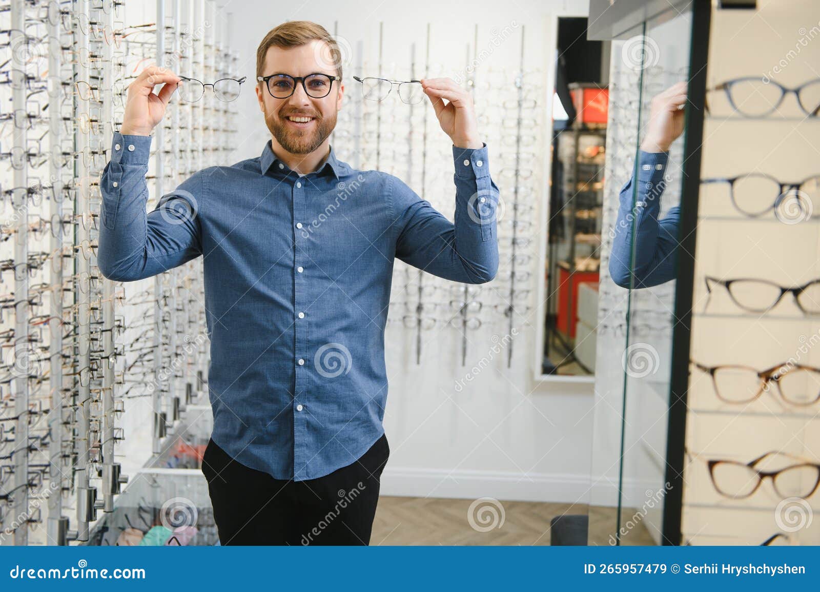 Man Evaluating Quality of Glasses in Optical Shop Stock Image - Image ...