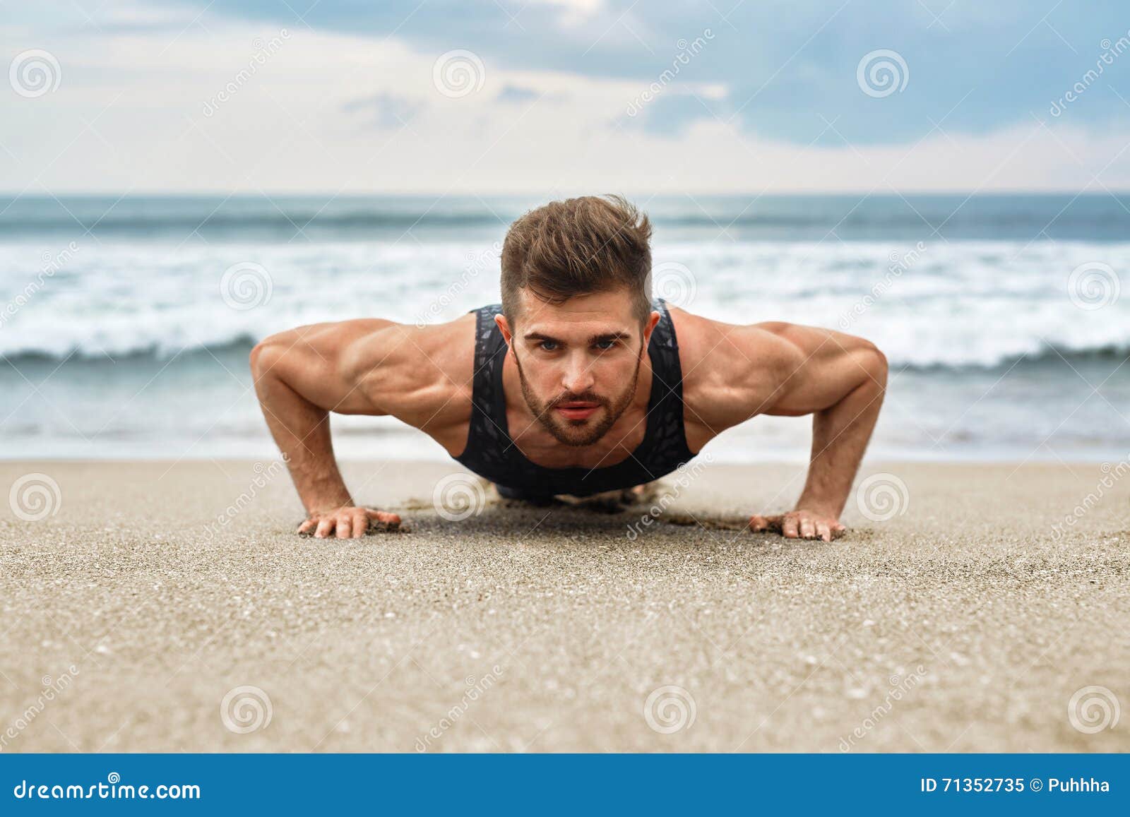 man exercising, doing push up exercises on beach. fitness workout