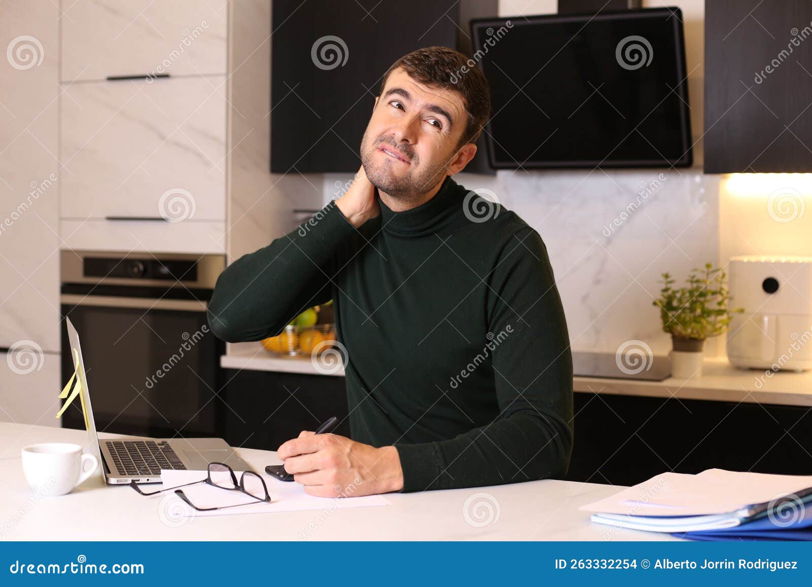 Man Experimenting Neck Pain while Working from Kitchen Counter Stock Photo Image of back
