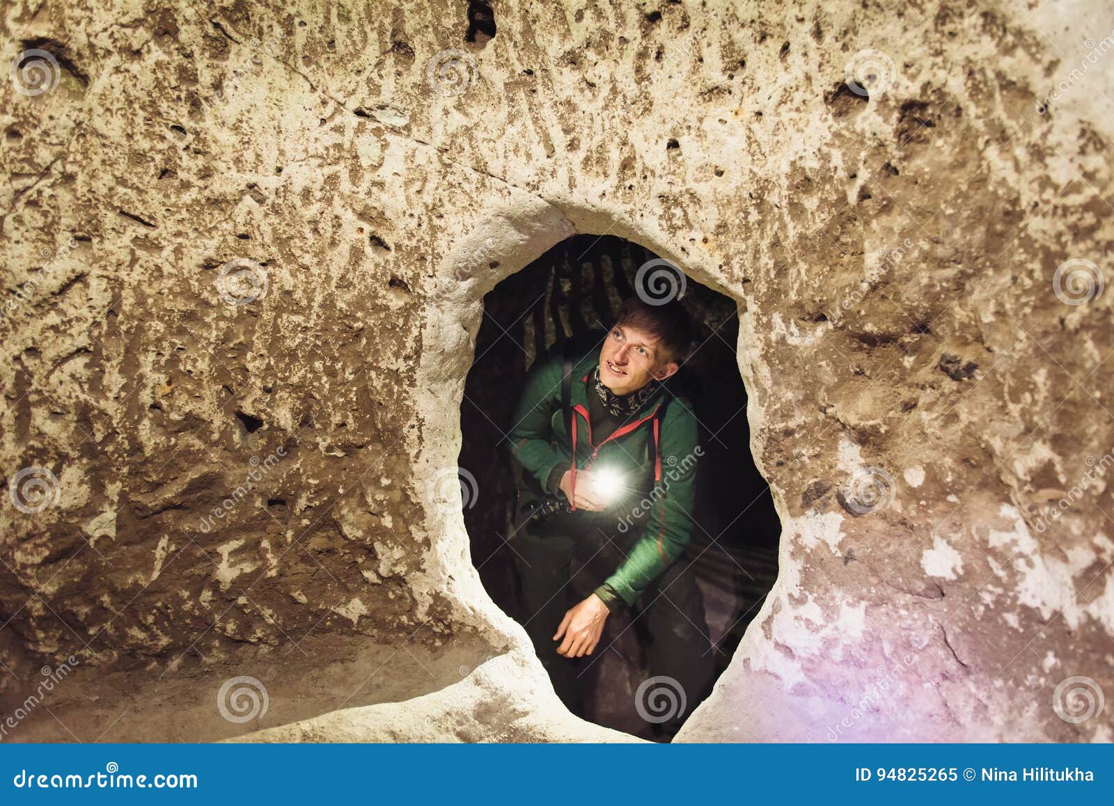 man exploring caves in derinkuyu underground city