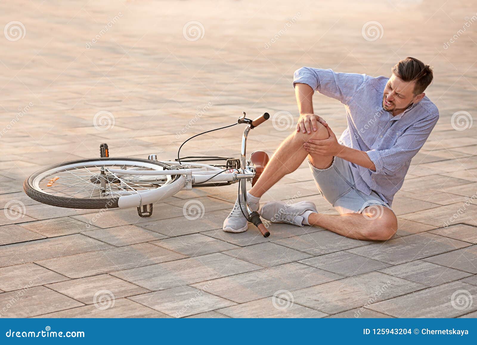 Man fallen off his bicycle stock photo. Image of caucasian 125943204