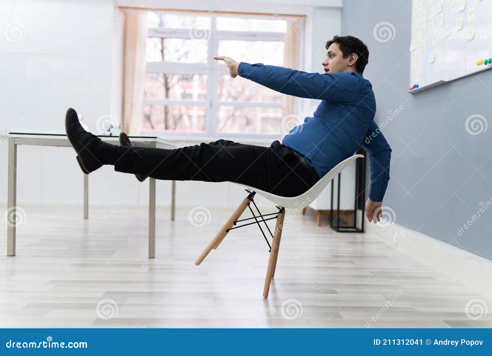 Man Falling on Chair in Office Stock Image - Image of clumsy, shock