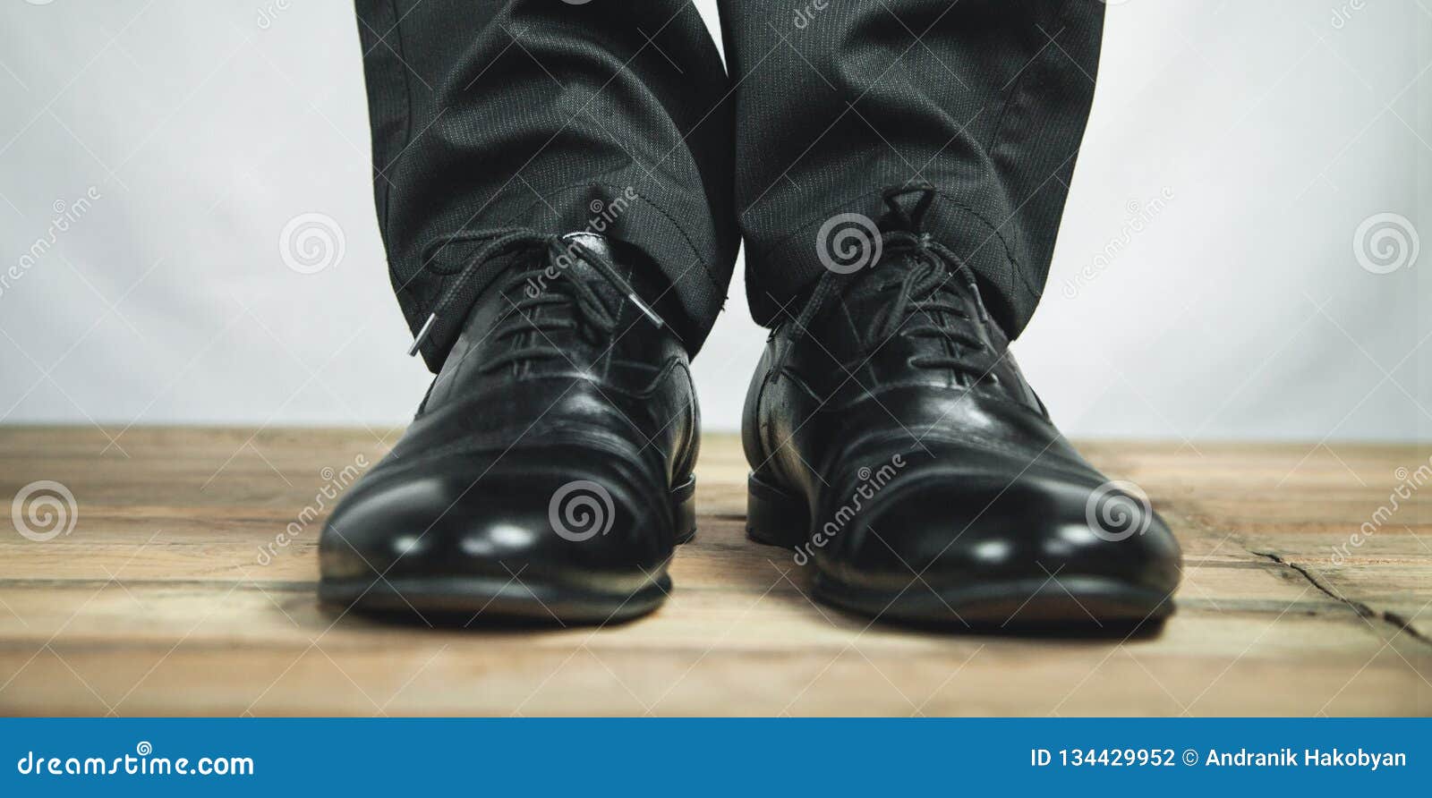 Man Feet in Black Leather Shoes Stands on Wooden Floor. Stock Photo ...