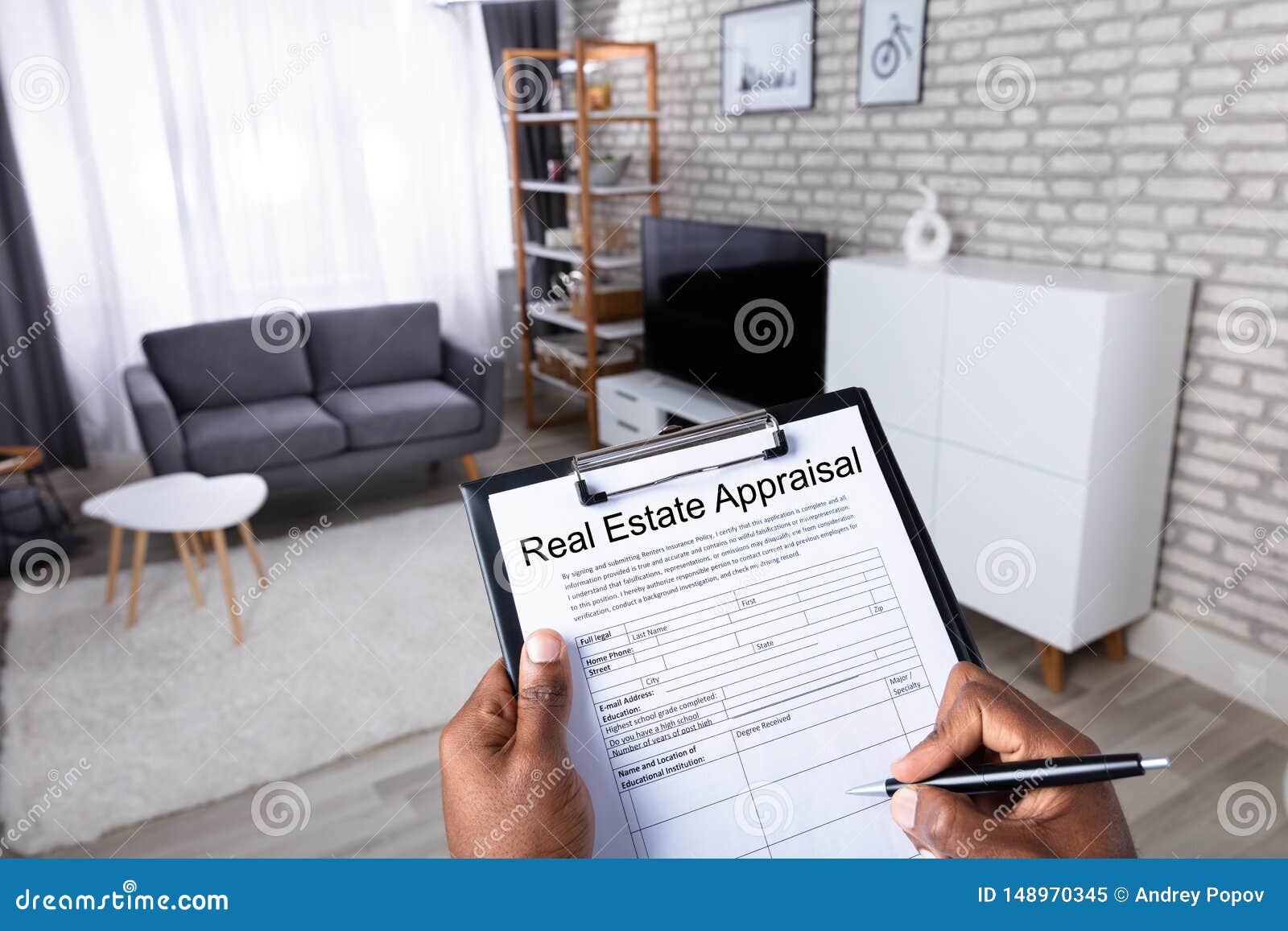man filling real estate appraisal form