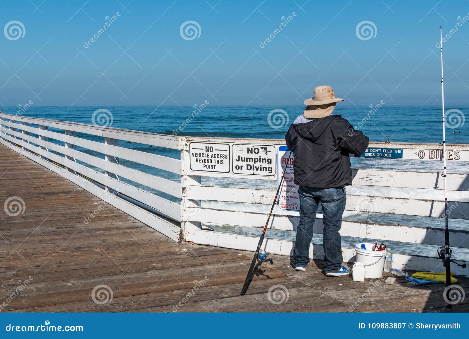 Man Fishes On Top Of Crystal Pier In Pacific Beach Editorial