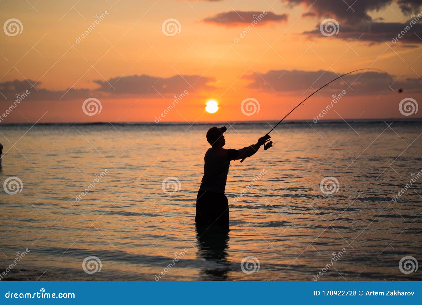 A Man Fishing in the Indian Ocean with the Beach at Sunset. Stock Photo -  Image of active, catch: 178922728