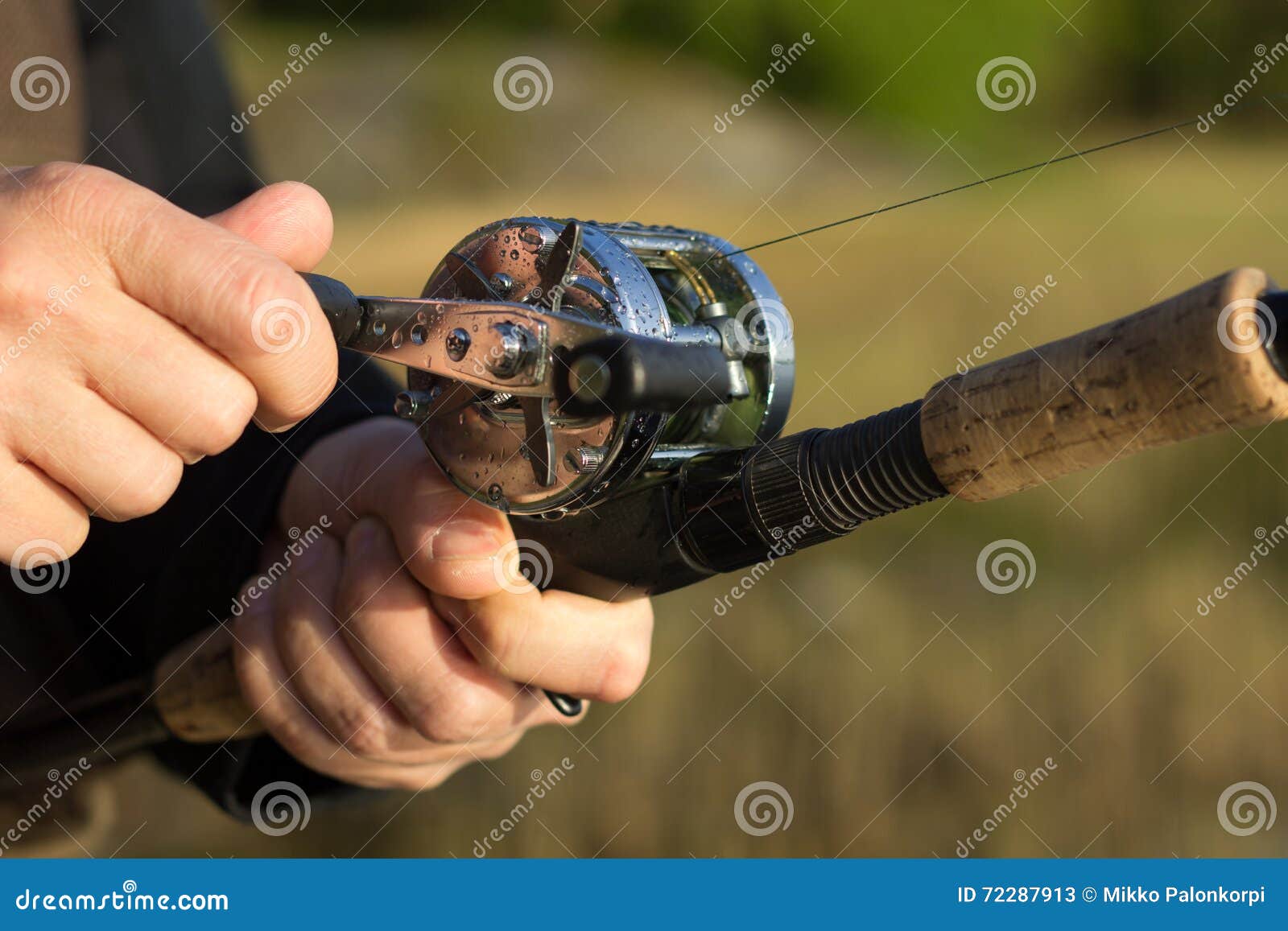 Man Fishing with Round Reel and Rod Stock Image - Image of metal, crank:  72287913