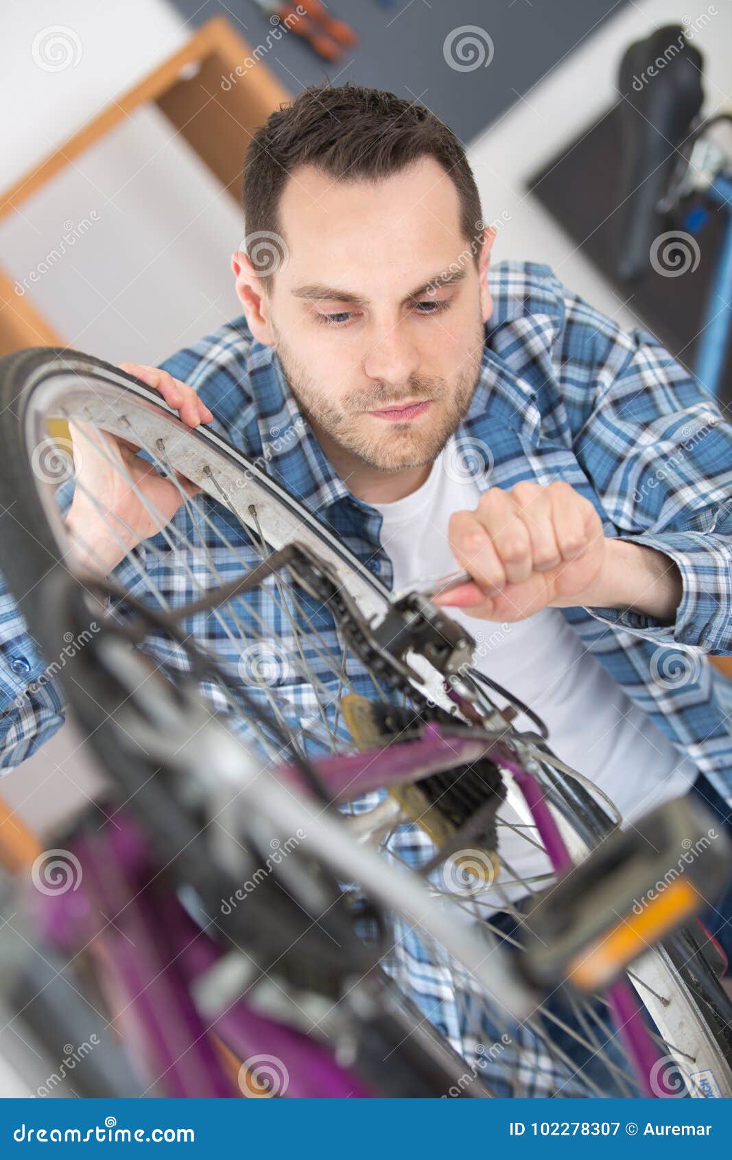 Man fixing bike chain stock image. Image of changing 102278307