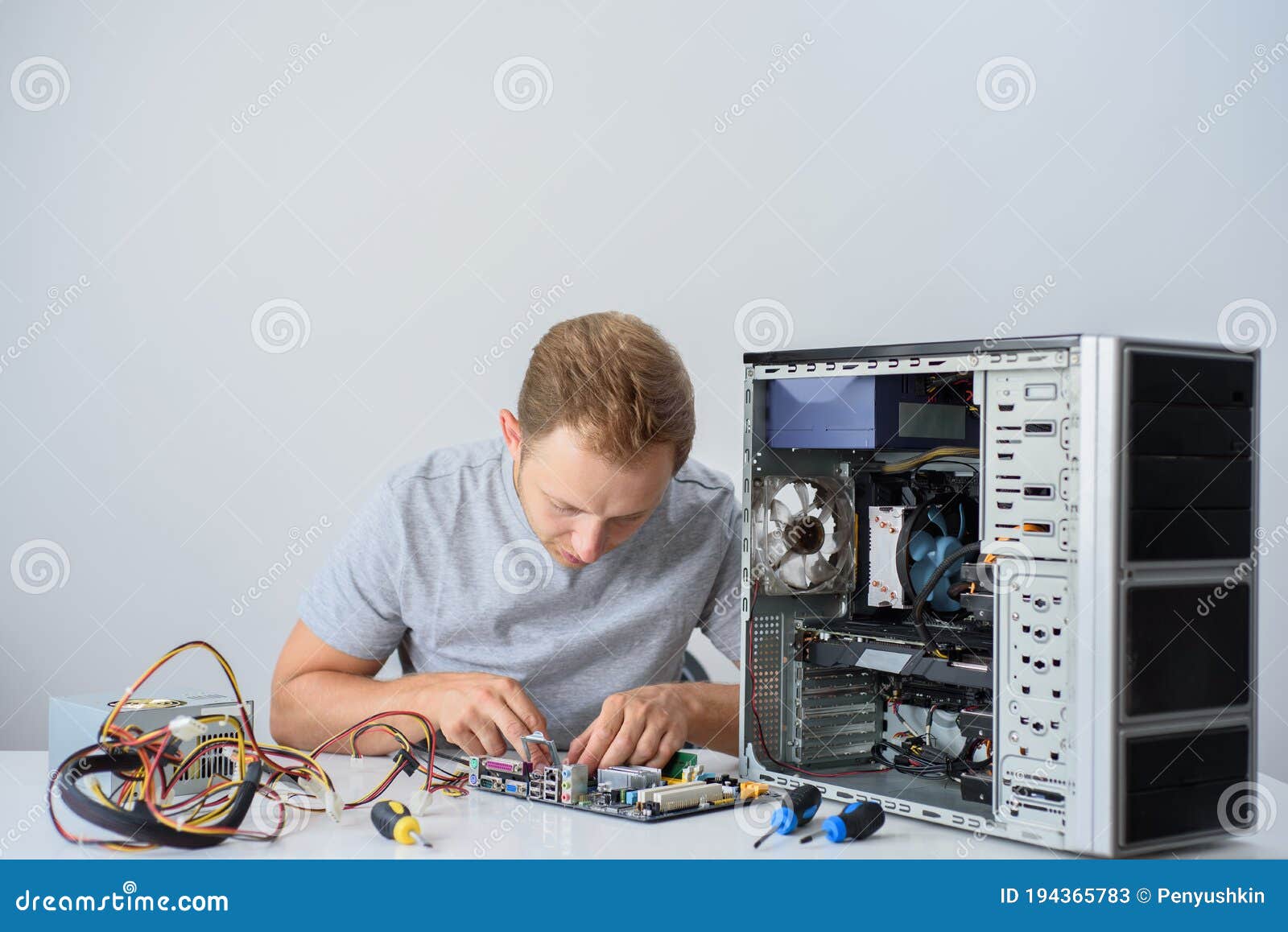 a man fixing a computer