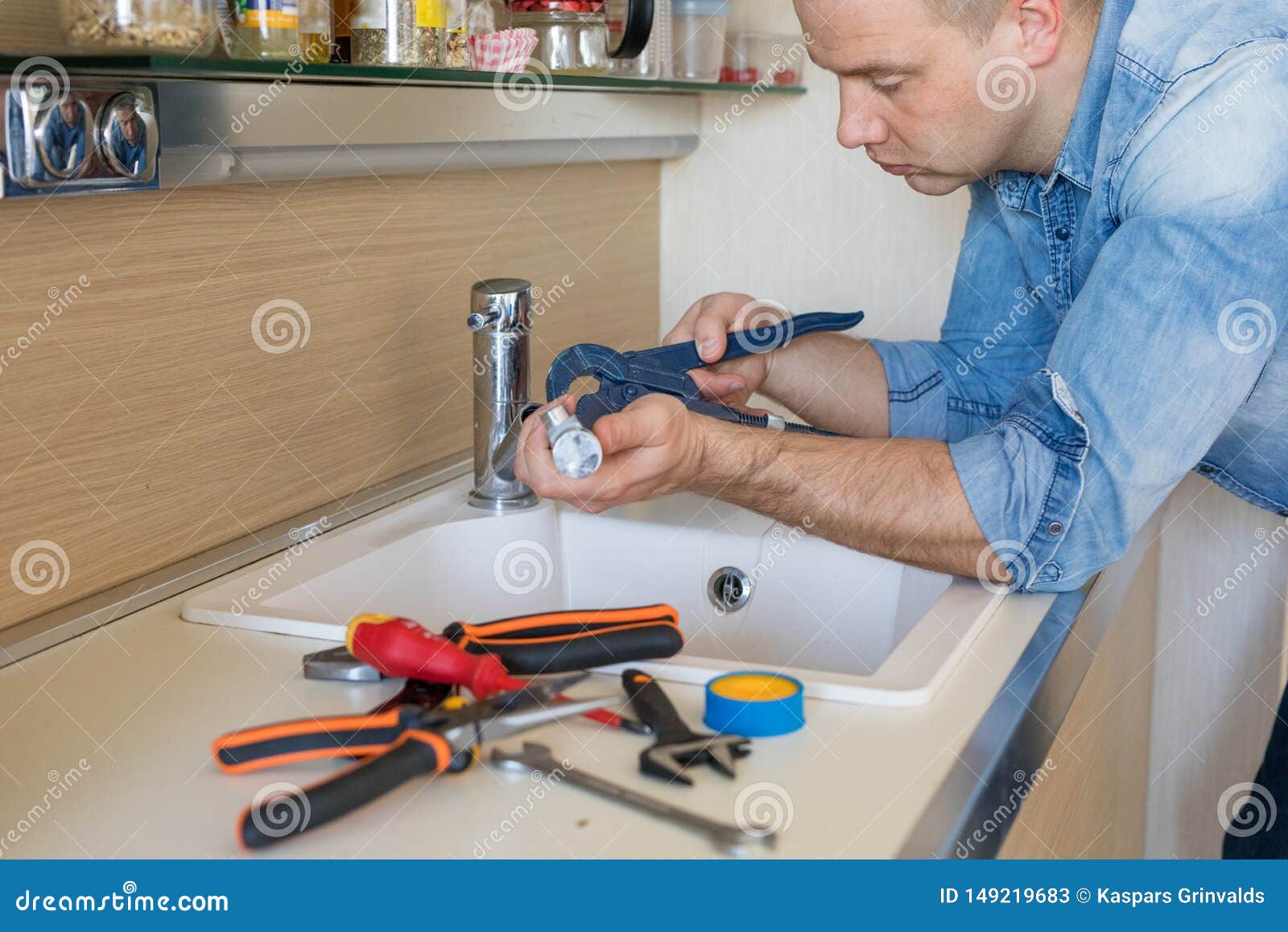 Man Fixing Leaking Tap in Kitchen Stock Image Image of adult, person