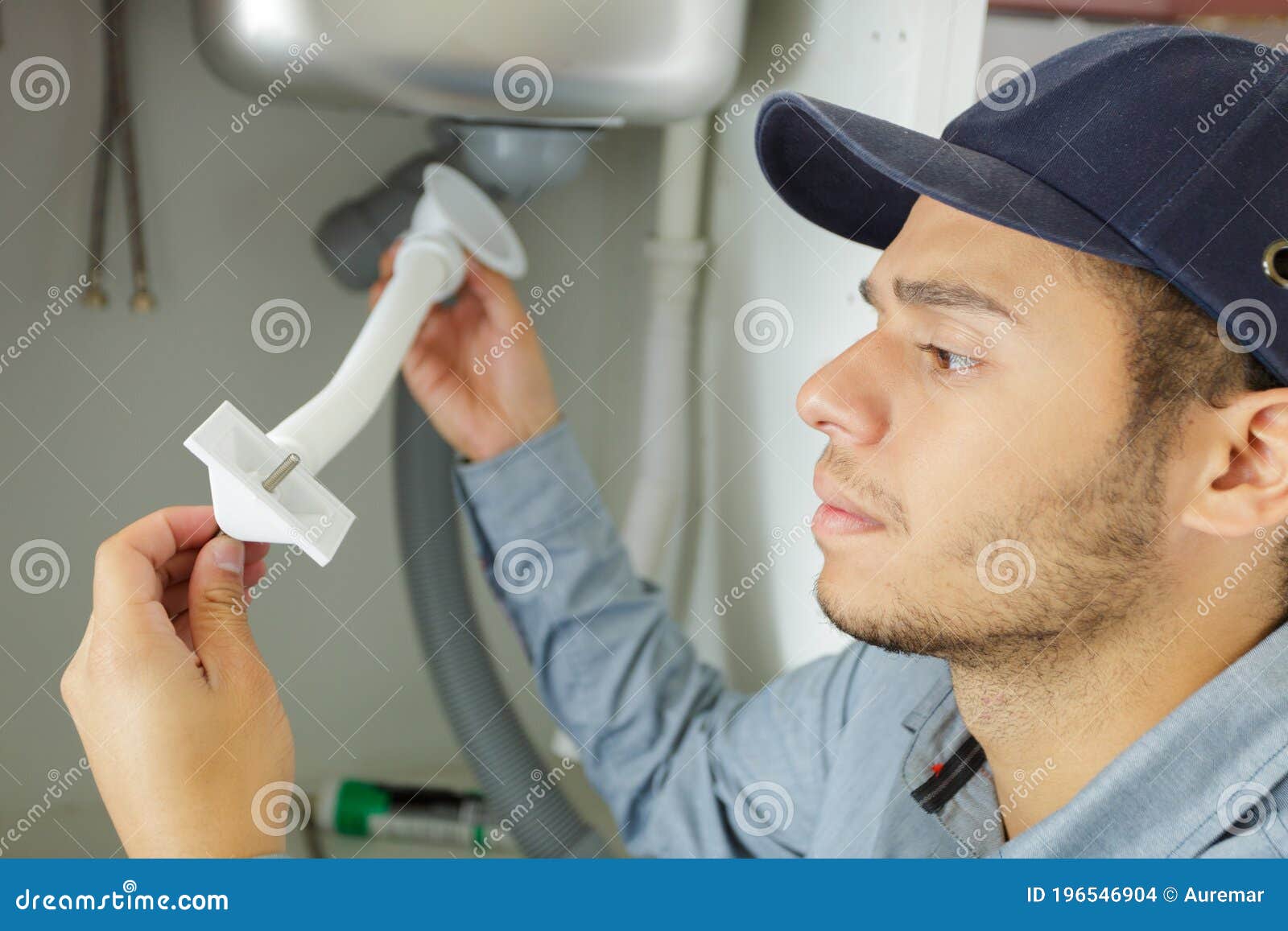 Man Fixing Pipes Under Sink Stock Photo Image of service, improvement