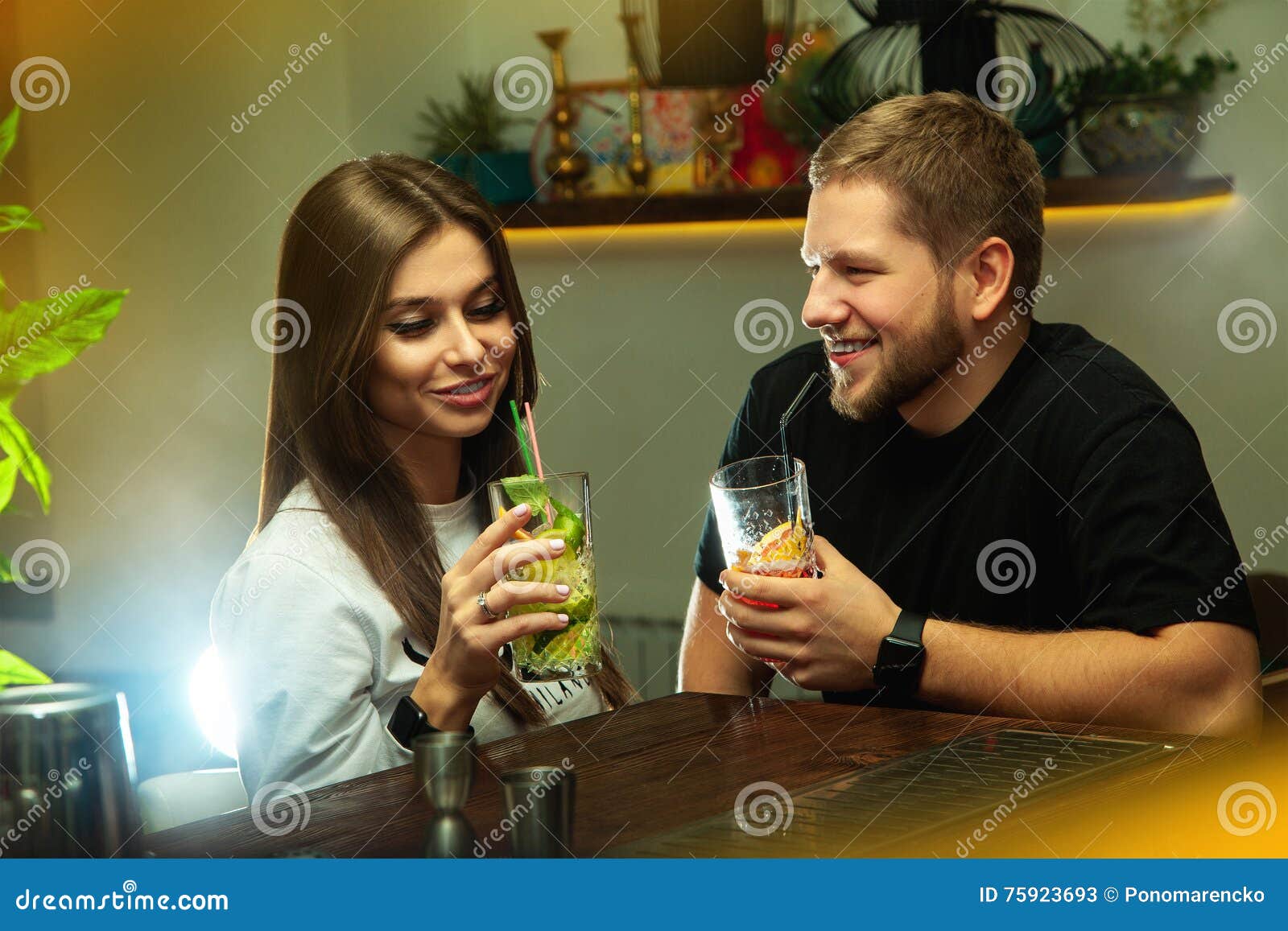 man flirting with beautiful woman in the bar