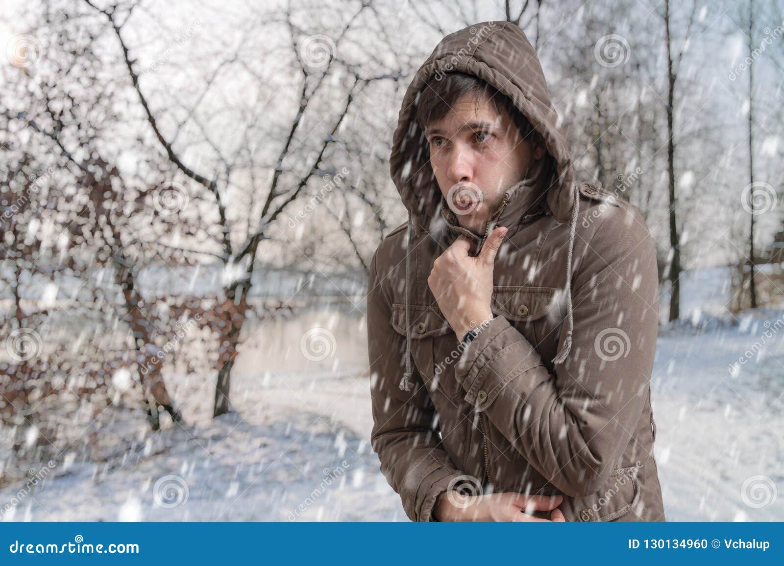 man is freezing outside in cold winter