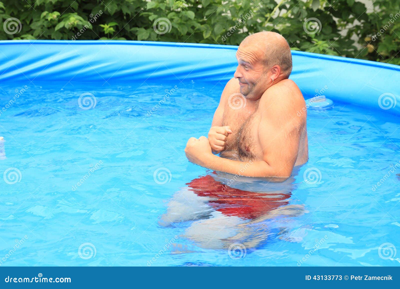 man freezing in pool