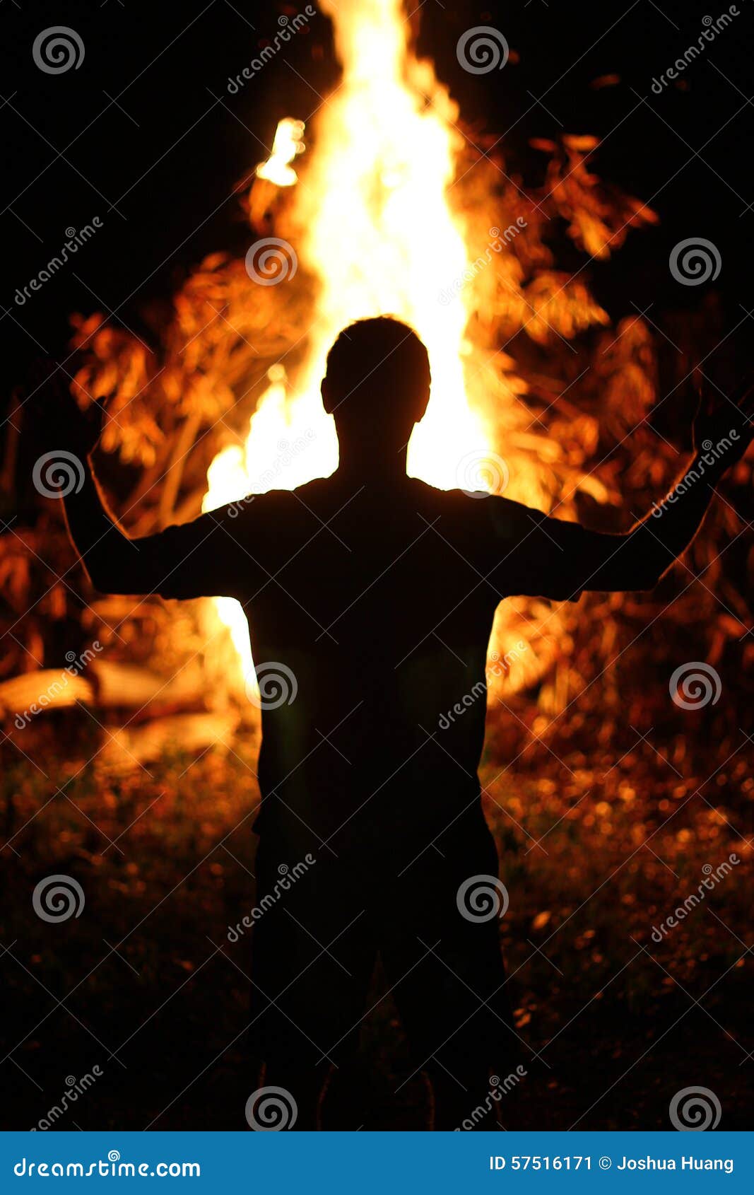 Man in Front of Fire stock image. Image of sillhouette 57516171