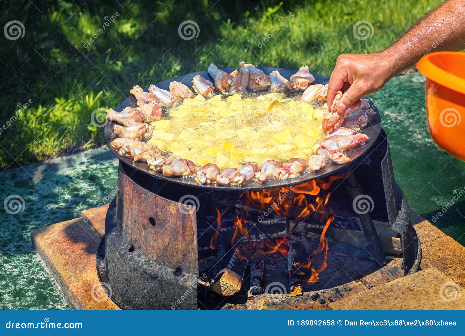 Man Chicken Wings and at Barbecue Grill Disc Wok at Backyard Bbq Stock Photo - Image of cooked, close: 189092658