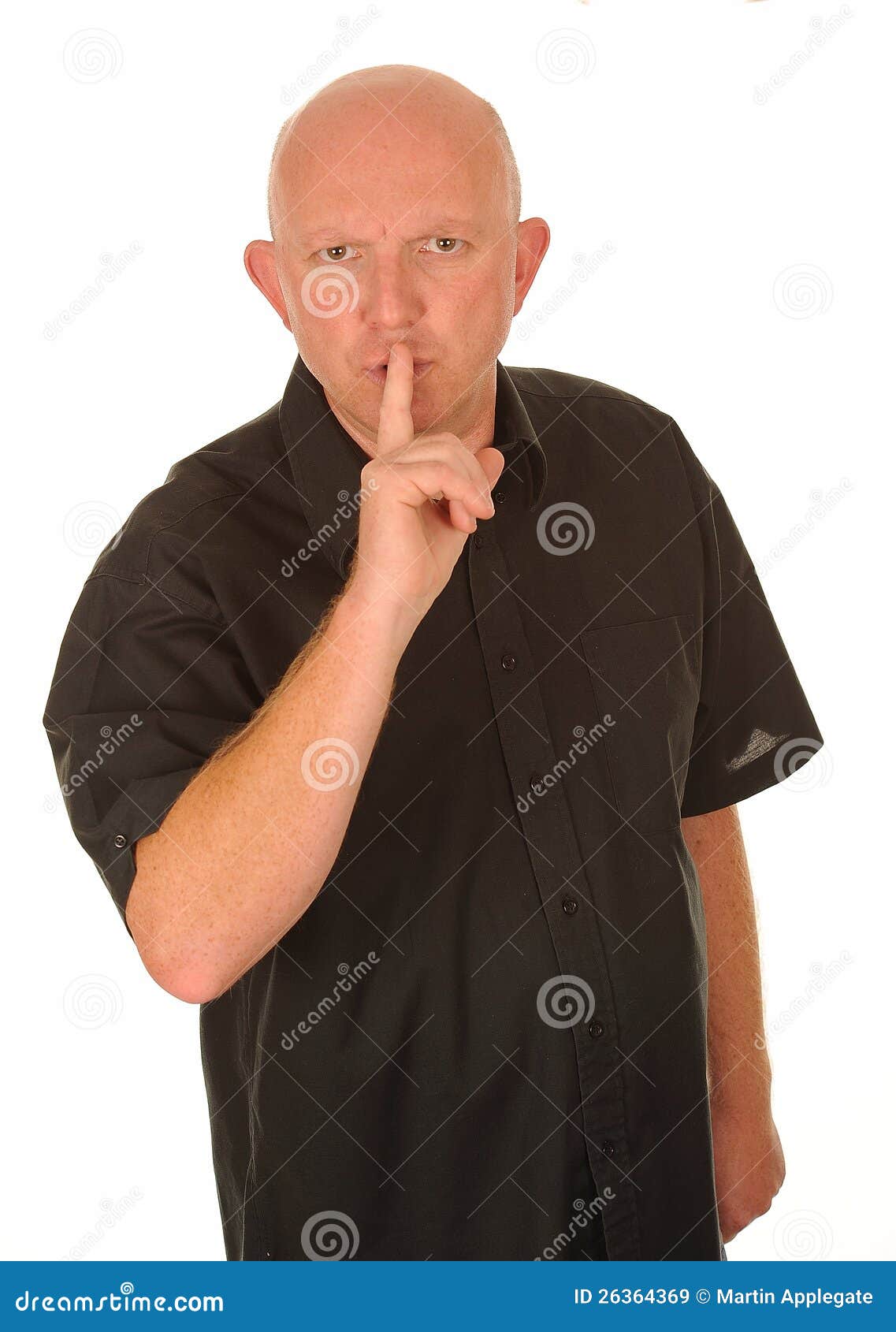 man gesturing for quiet