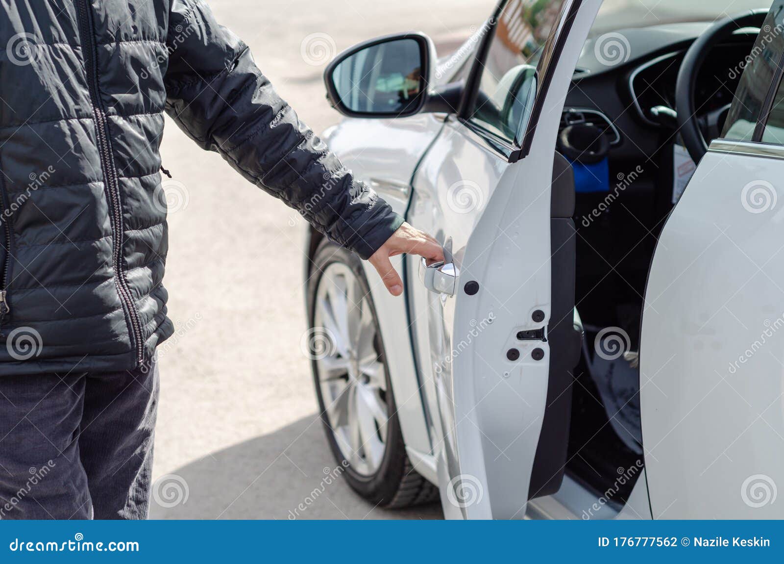 The Man is Getting into a Car Stock Photo Image of person, holding