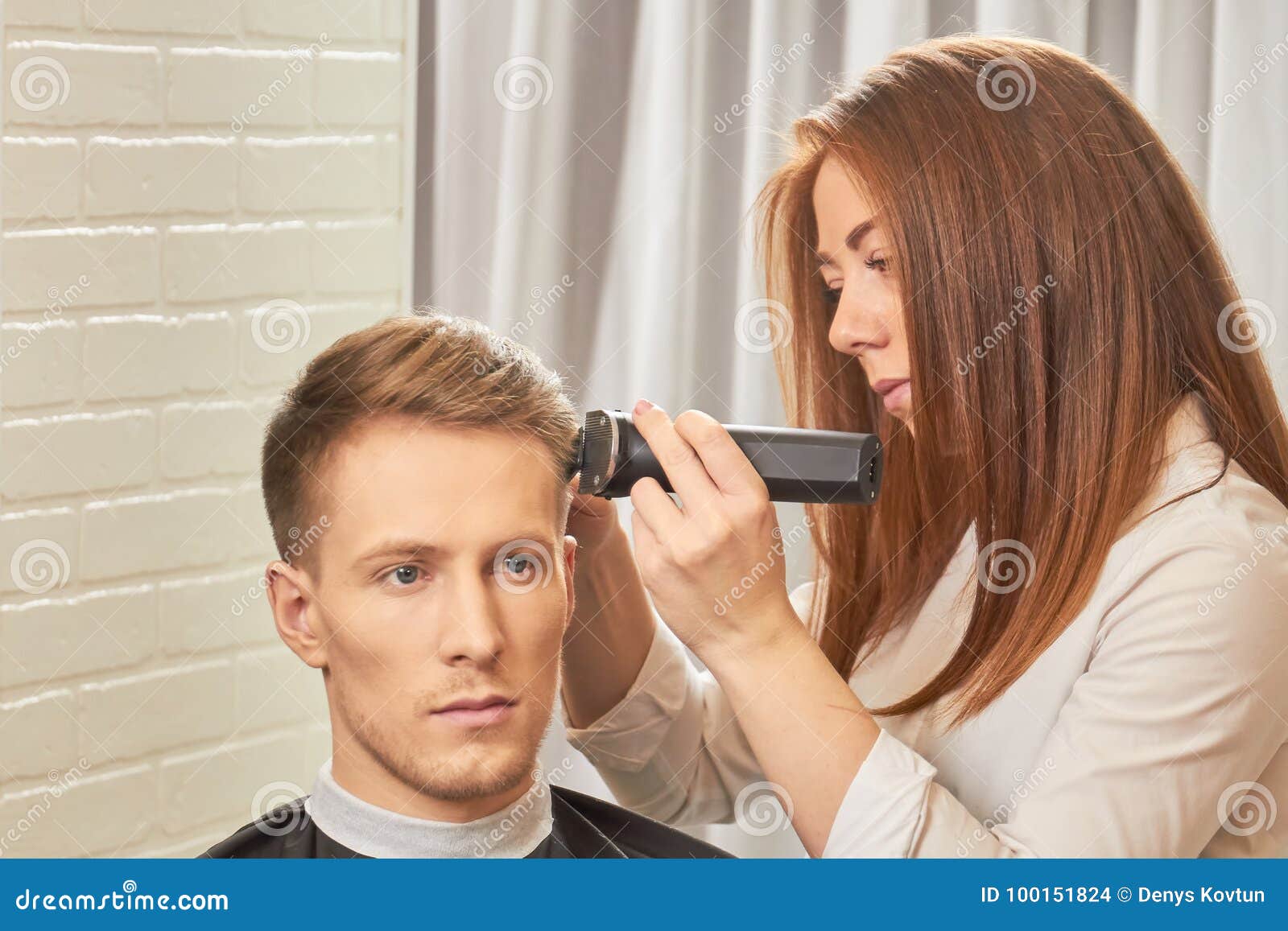 Man getting a haircut. stock photo. Image of hairclipper - 100151824