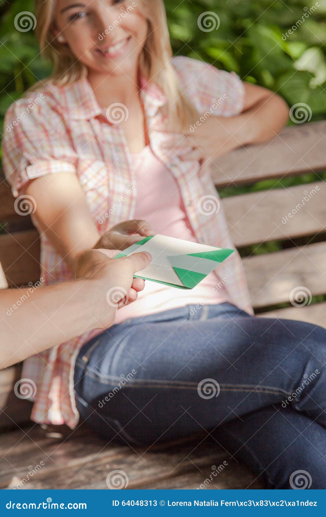 man giving a card to his girlfriend