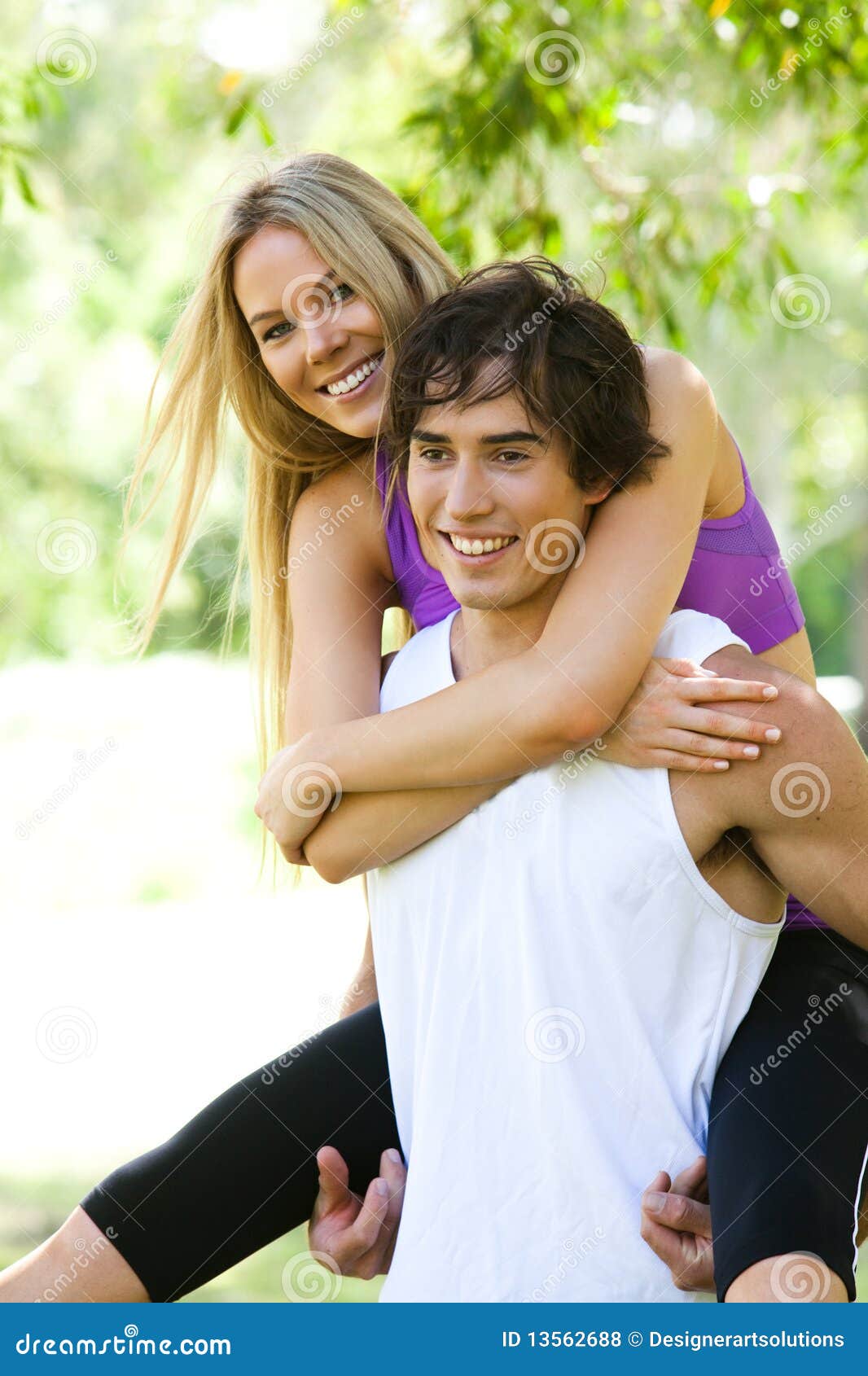 Young Man Giving Woman Piggyback Outdoors, Stock image