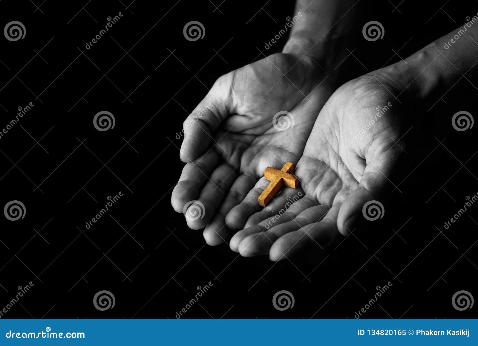 man giving simple wood cross sign. concept of evangelism jesus christ to the others