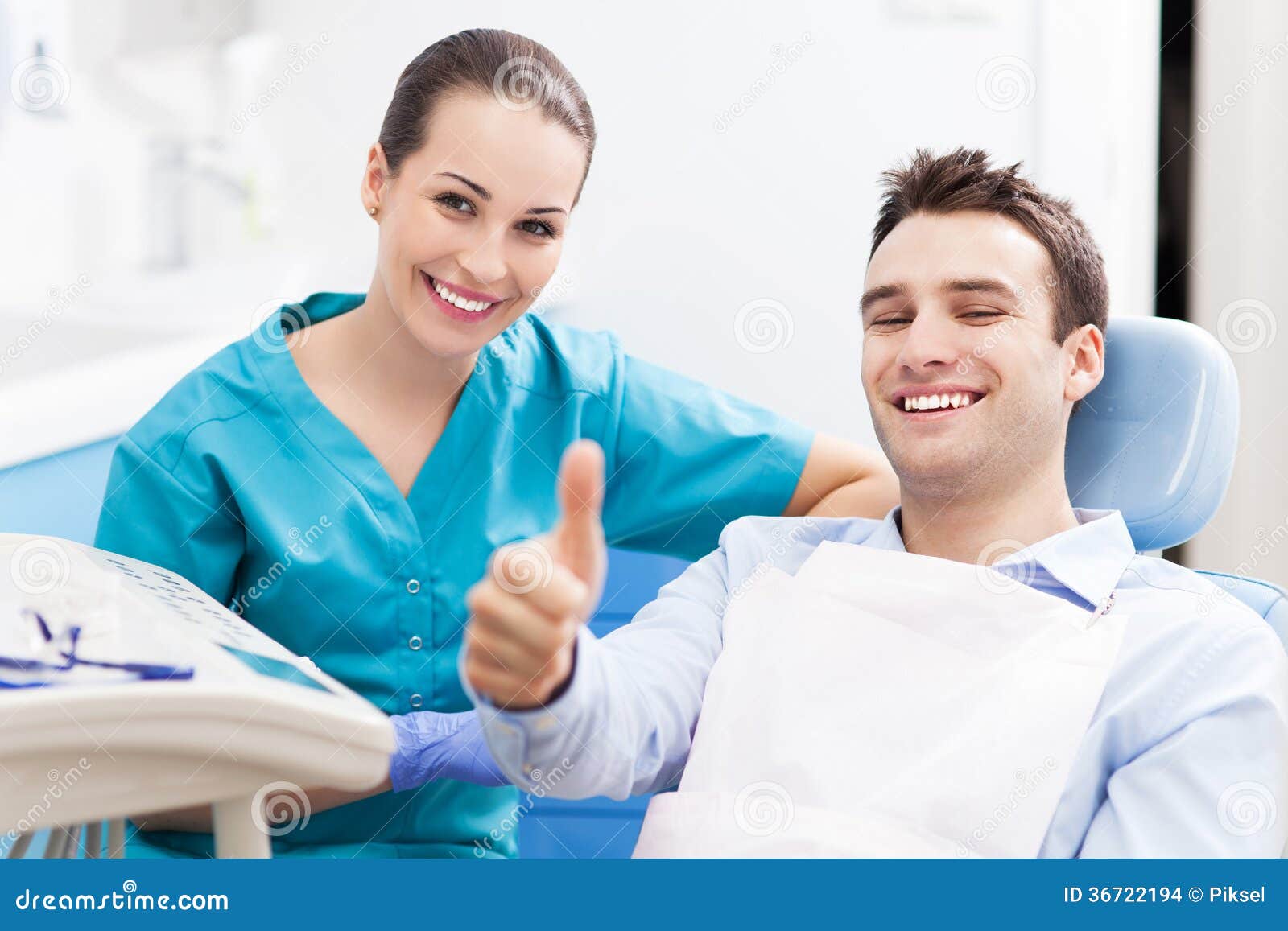 man giving thumbs up at dentist office