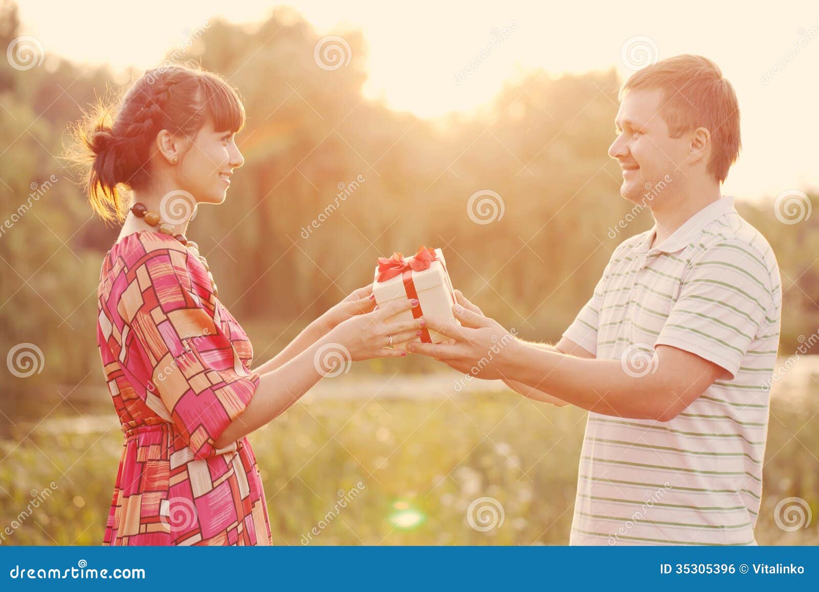 man giving to his woman a gift box. retro style.