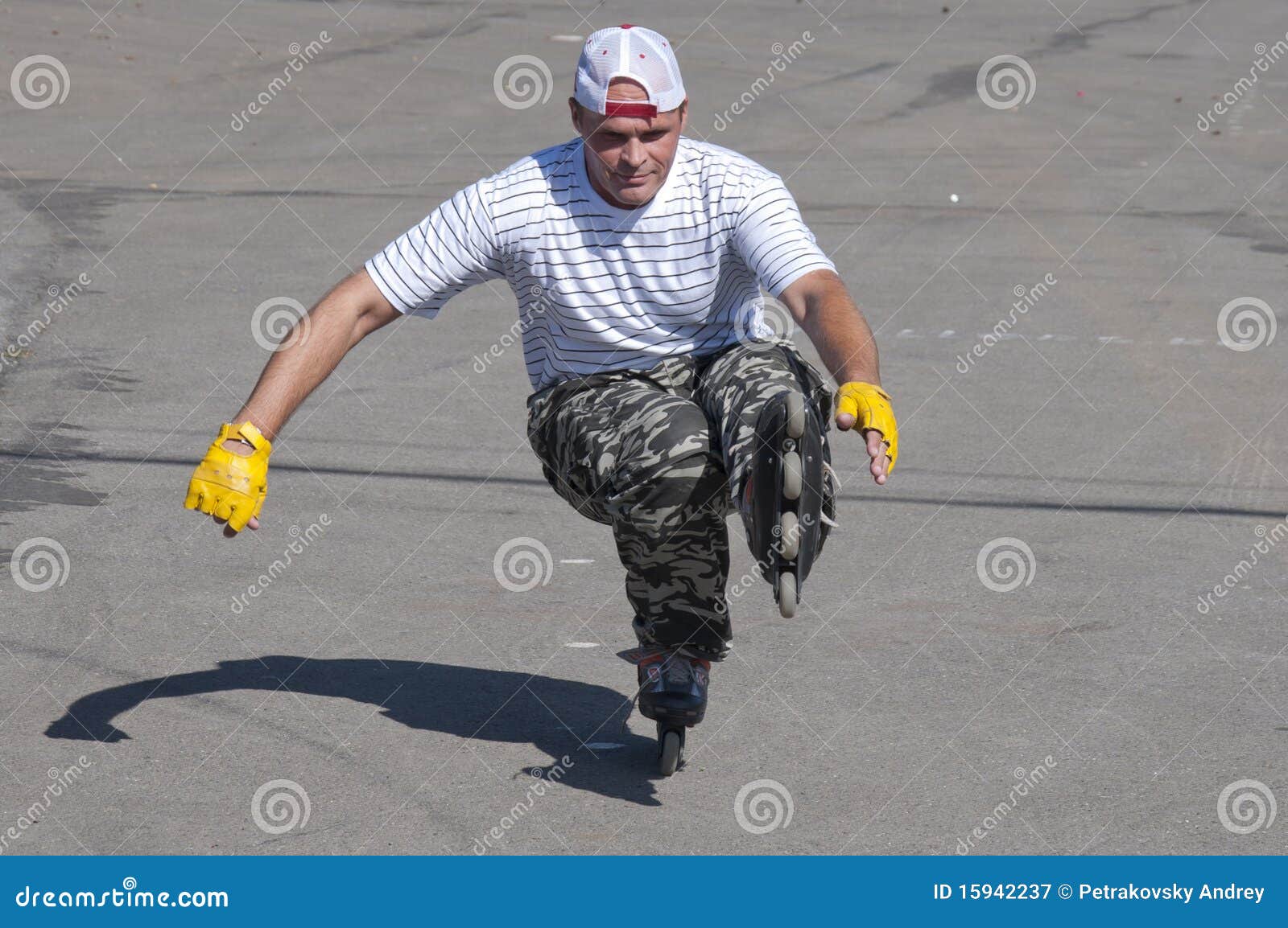 The Man Goes for a Drive on Roller Skates in a Sun Stock Image Image