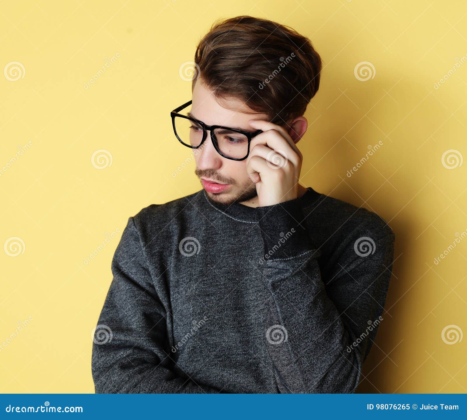 Man With Great Smile Wearing Fashion Eyeglasses Against Yellow Stock