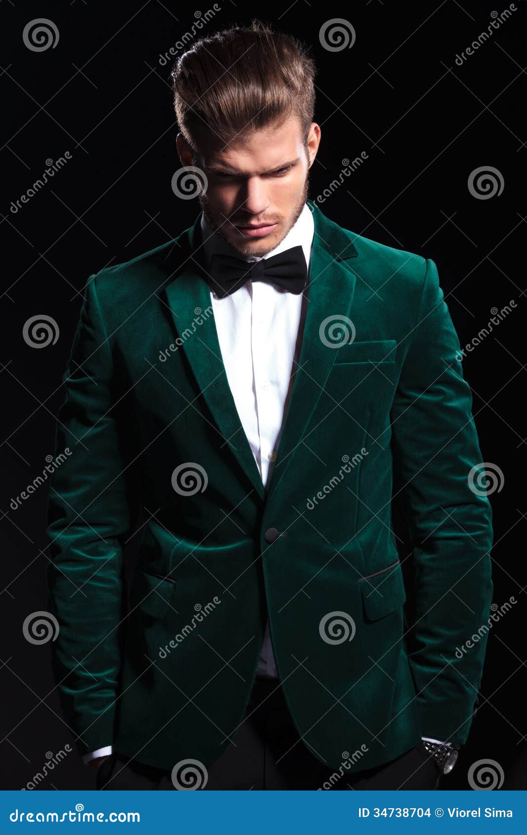 Man In A Green Velvet Suit Is Looking Down Stock Images 