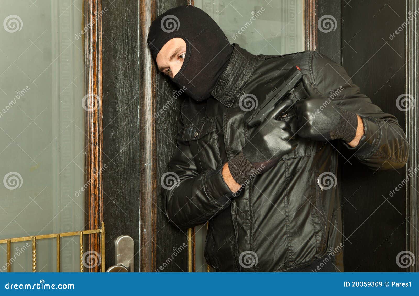 Man with a gun in his hand stock image. Image of criminal - 20359309