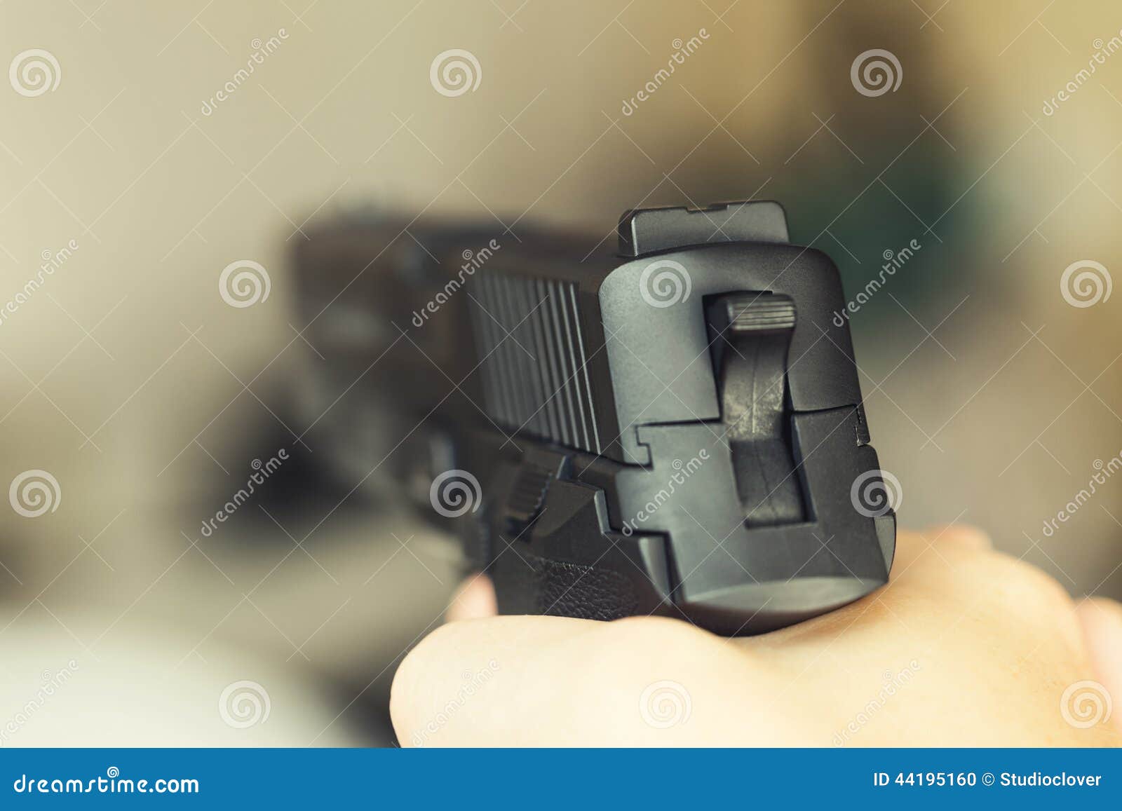 Serious Man Is Ready To Fire A Gun High-Res Stock Photo 