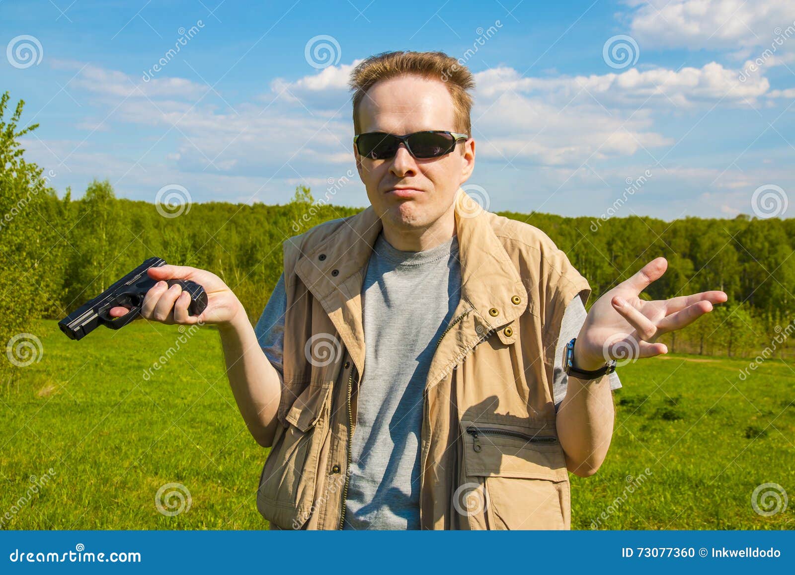 A Man with a Gun Throws Up His Hands Stock Photo Image of black