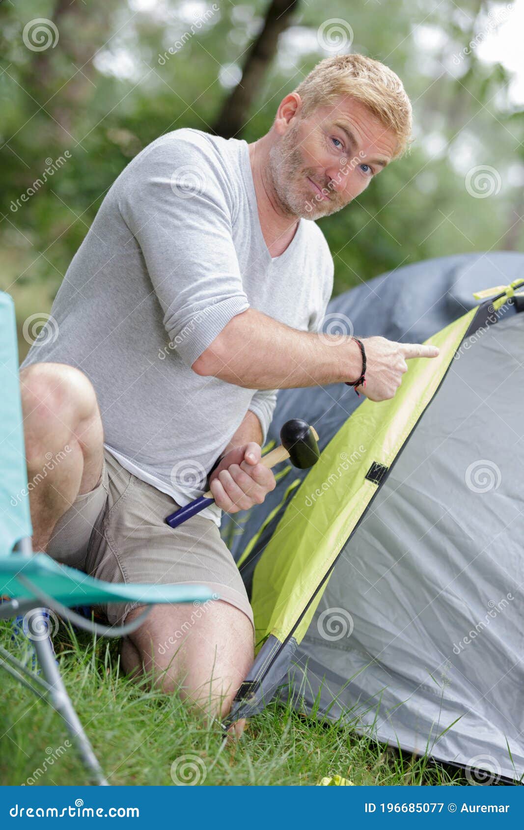 Man with Hammer Pitching Tent Stock Image - Image of tent, vacation ...