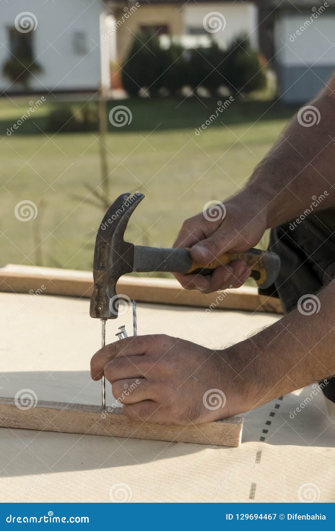 Man Hammering Nails in To Construction Elements. Stock Image Image of