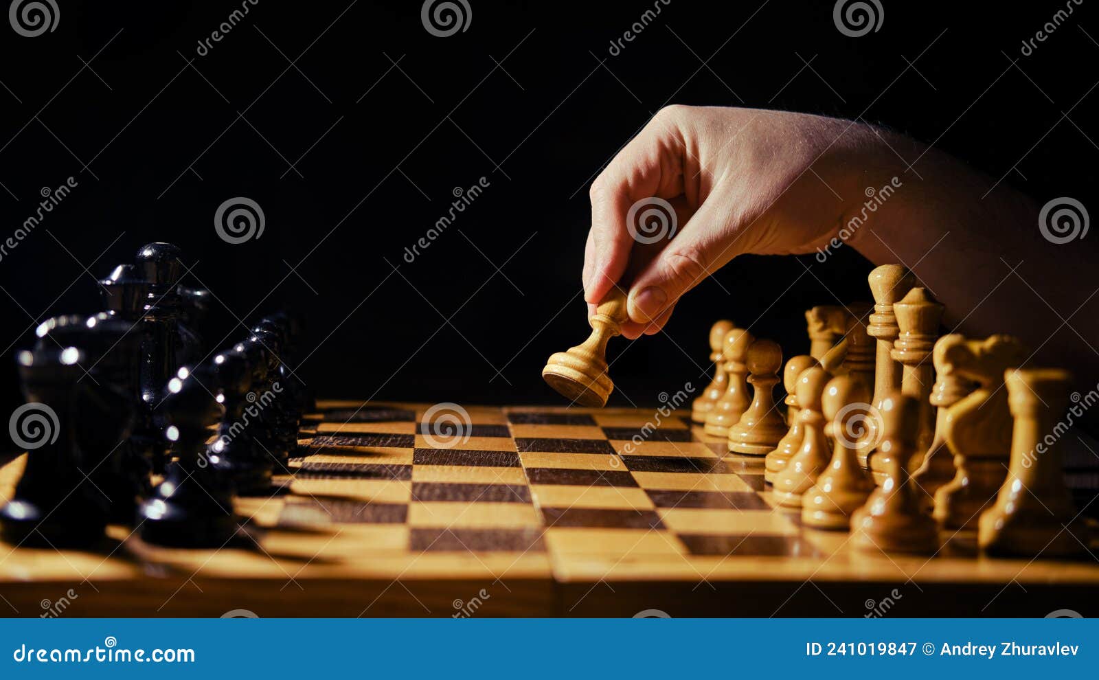 A Man Hand with a Chess Piece in a Board Game. Opening of the Chess Game  with the Move of the White King Pawn E2-e4, Copy Space on Stock Image -  Image