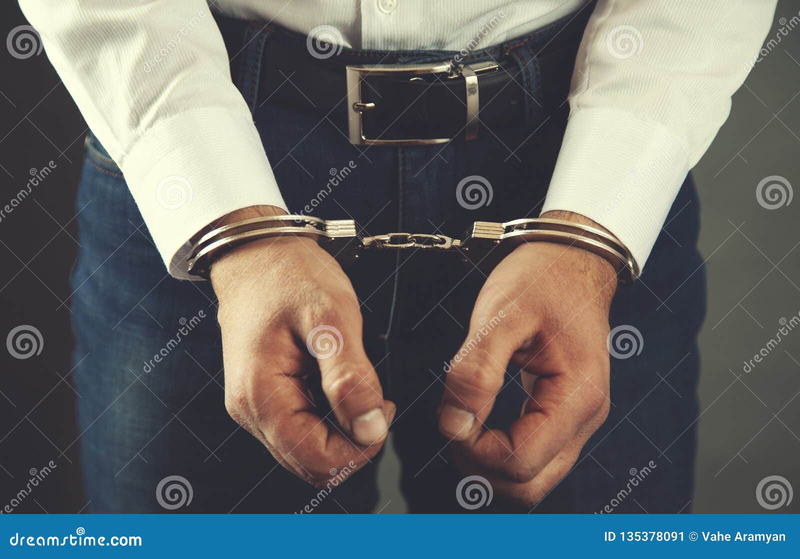 Man hand handcuffs stock image. Image of handcuffed 135378091