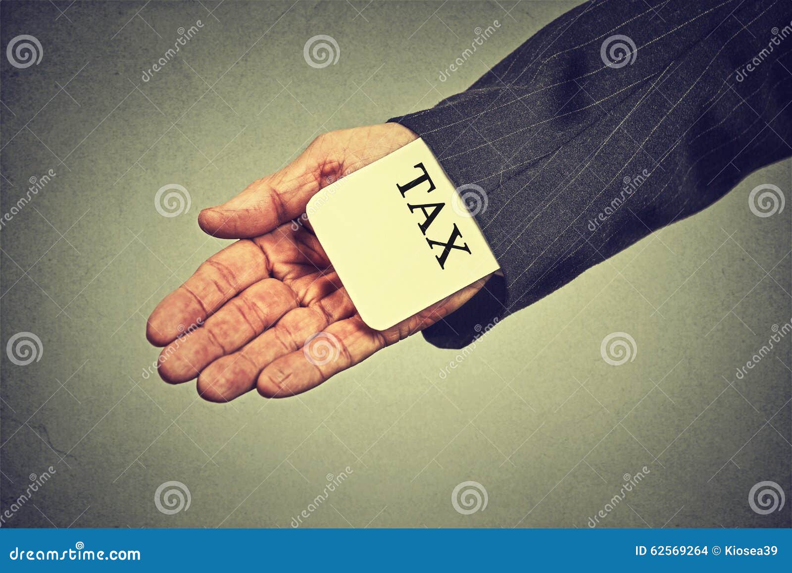 man hand hiding tax card in a sleeve of a suit. tax evasion economy concept