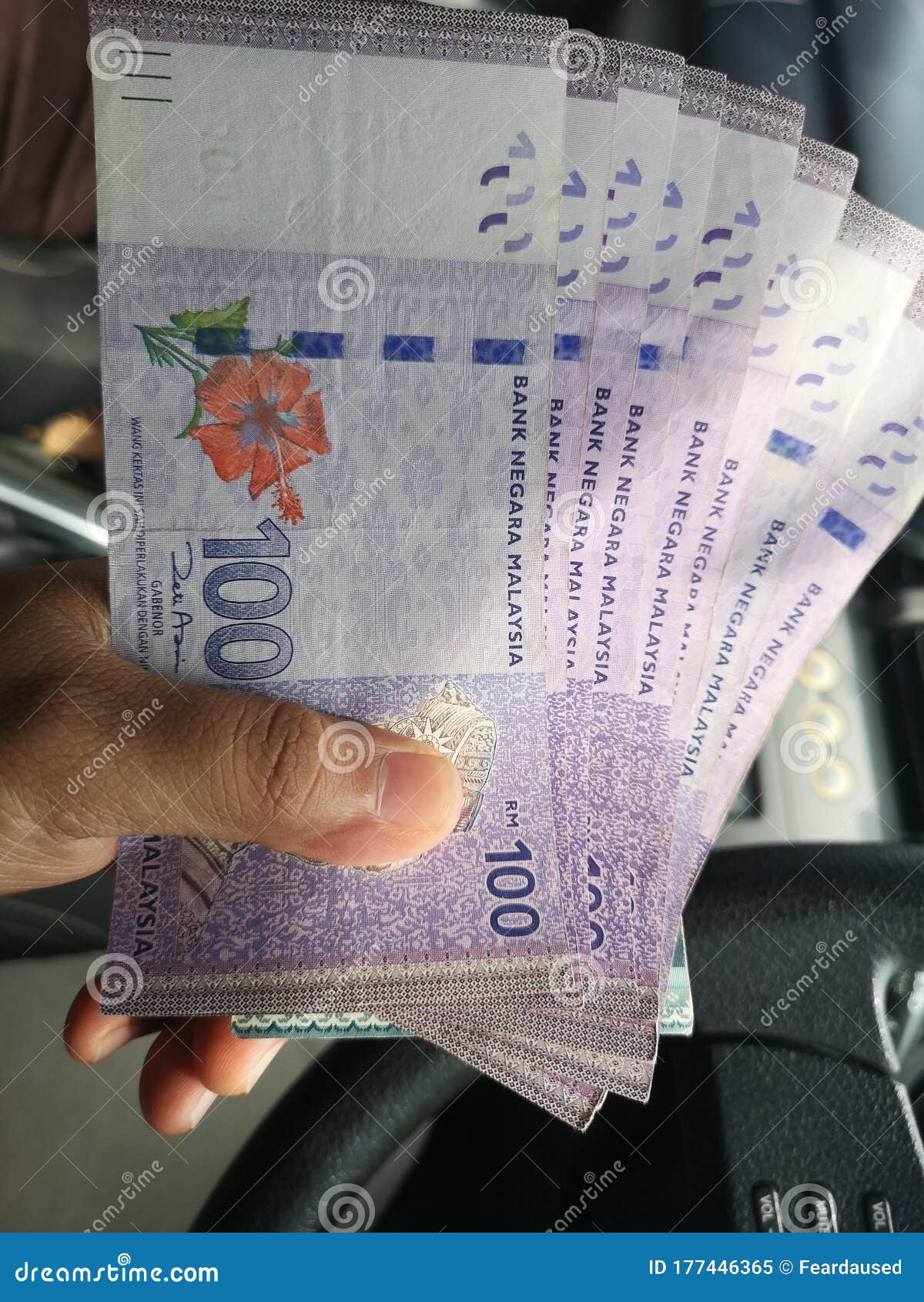 Man Hand Hold One Hundred Ringgit Malaysia Bills. Stock Image - Image of  banknote, money: 177446365