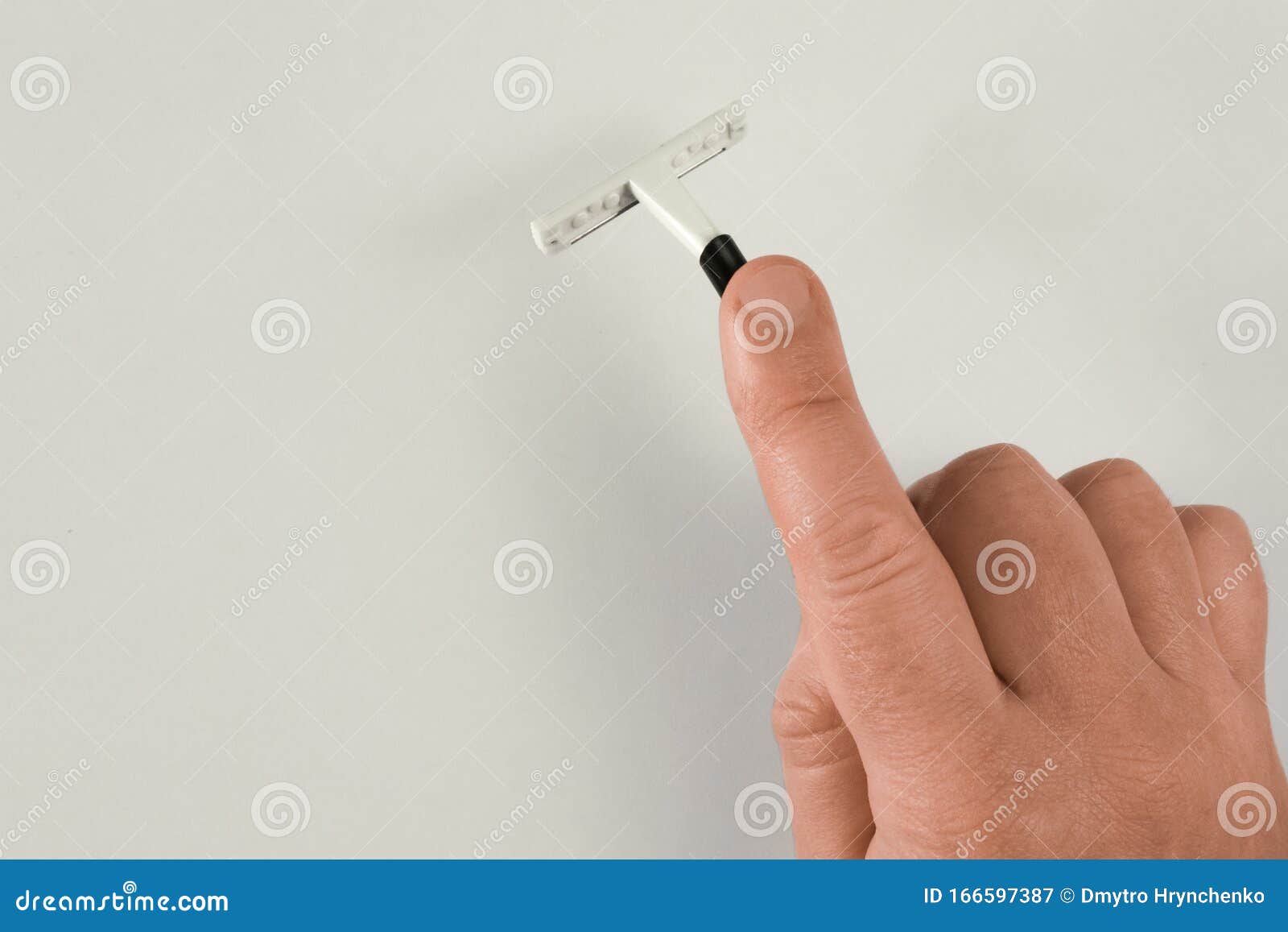 Man Hand Holds Shaving Stick. Mock-up On Light Background With Shadow And Copy Space. Middle ...
