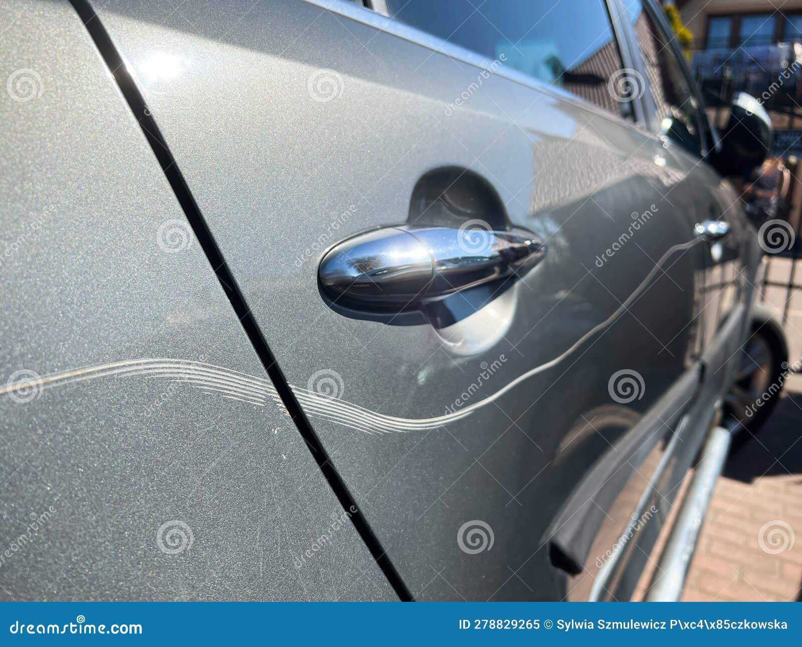 Man Hand Scratching a Car Body Surface with a Key. Davastation