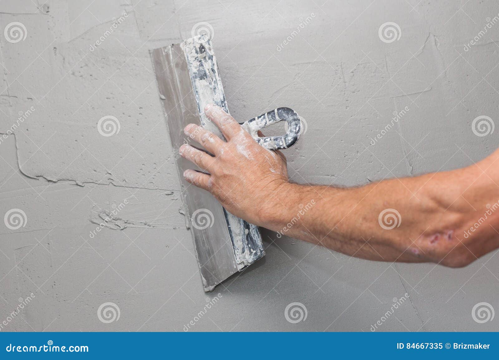 Man Hand with Trowel Plastering a Wall. Stock Image Image of cracks
