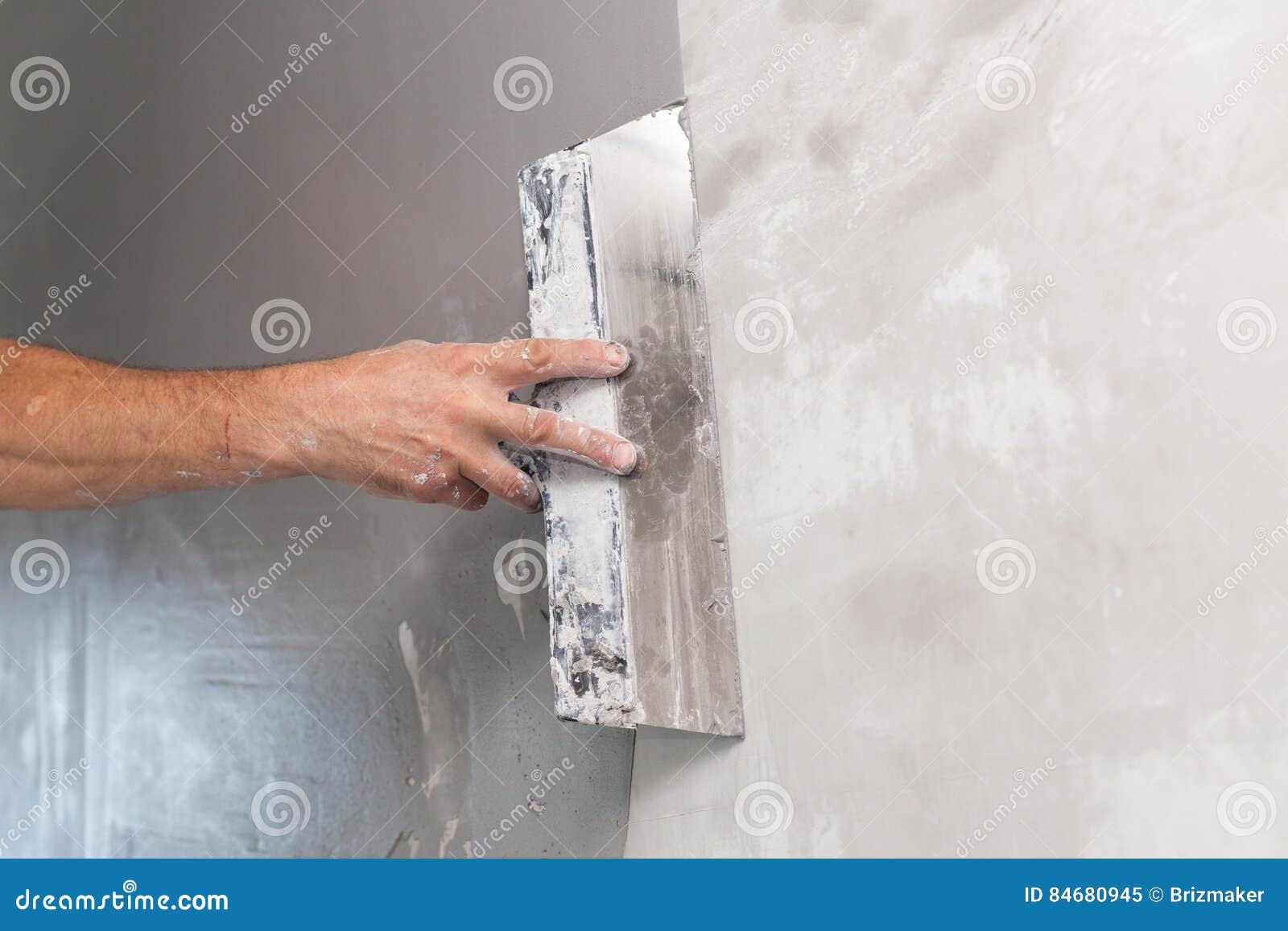 Man Hand with Trowel Plastering a Wall. Stock Image Image of material