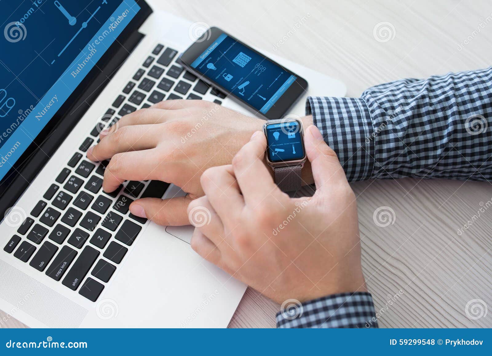 Man Hand In Watch With Smart Home Computer And Phone Stock Photo - Image: 592995481300 x 957