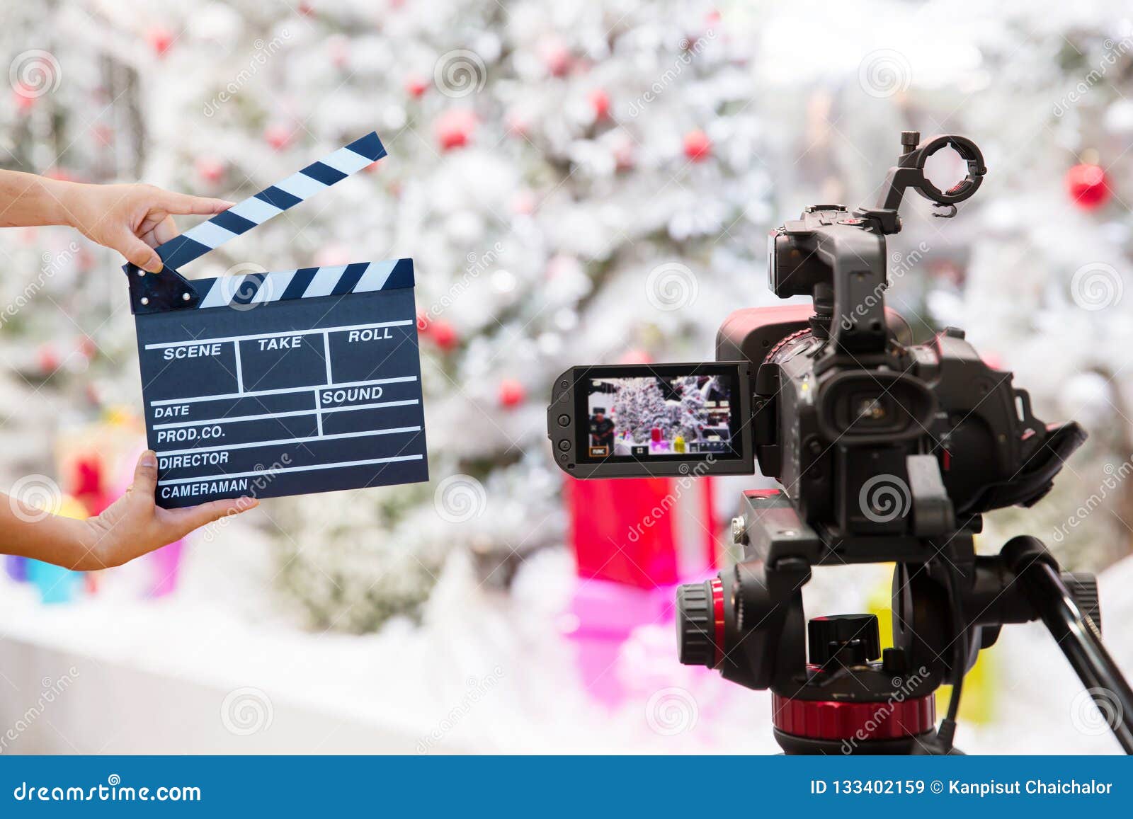 man hands holding movie clapper.film director concept.camera show viewfinder image catch motion in interview or broadcast christma