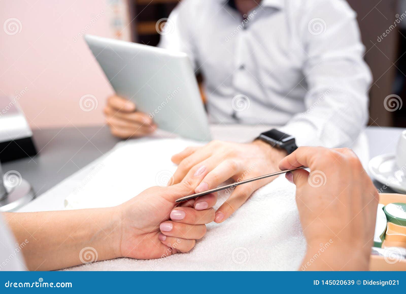 man hands manicure treatment with emery board