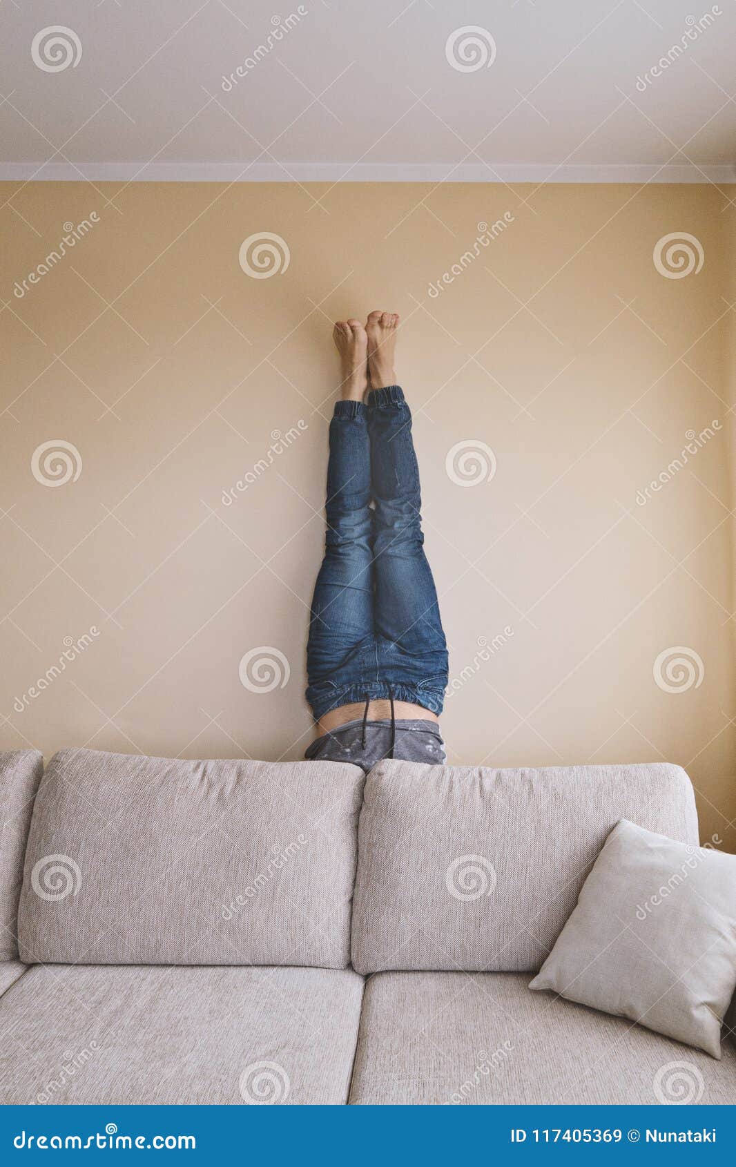 Man Handstanding Behind The Couch In Yoga Stock Image Image Of