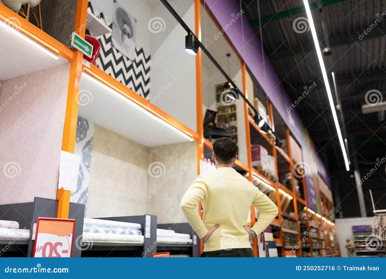 A Man in a Hardware Store is Studying Design Trends in a Showcase Stock Photo Image of