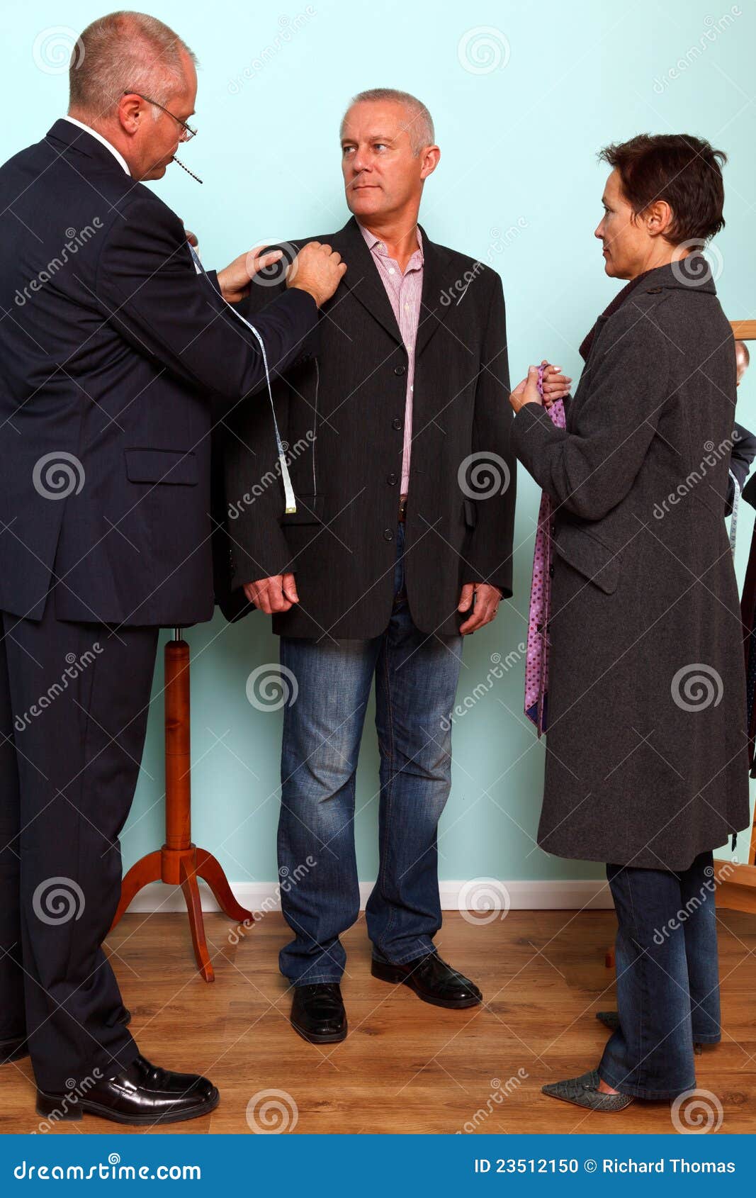 man having a bespoke suit fitted.